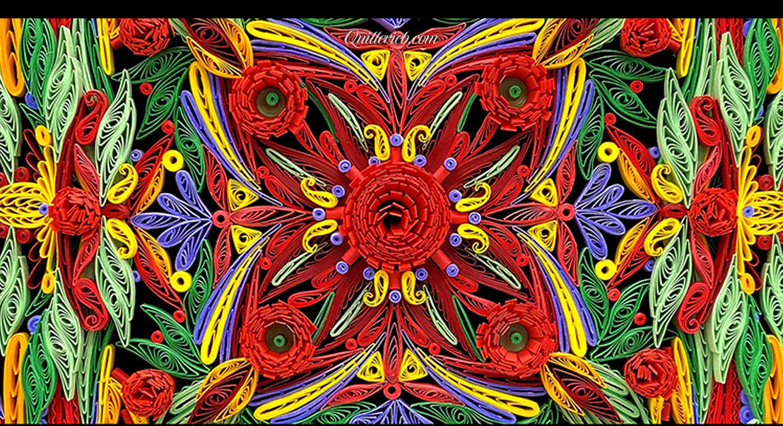 Square-shaped quilling in reds, yellows, greens and purples close-up view.