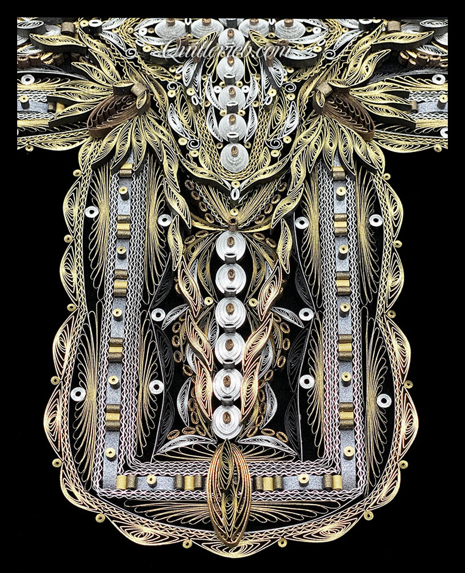 Image of quilled cross gold and silver lower half.