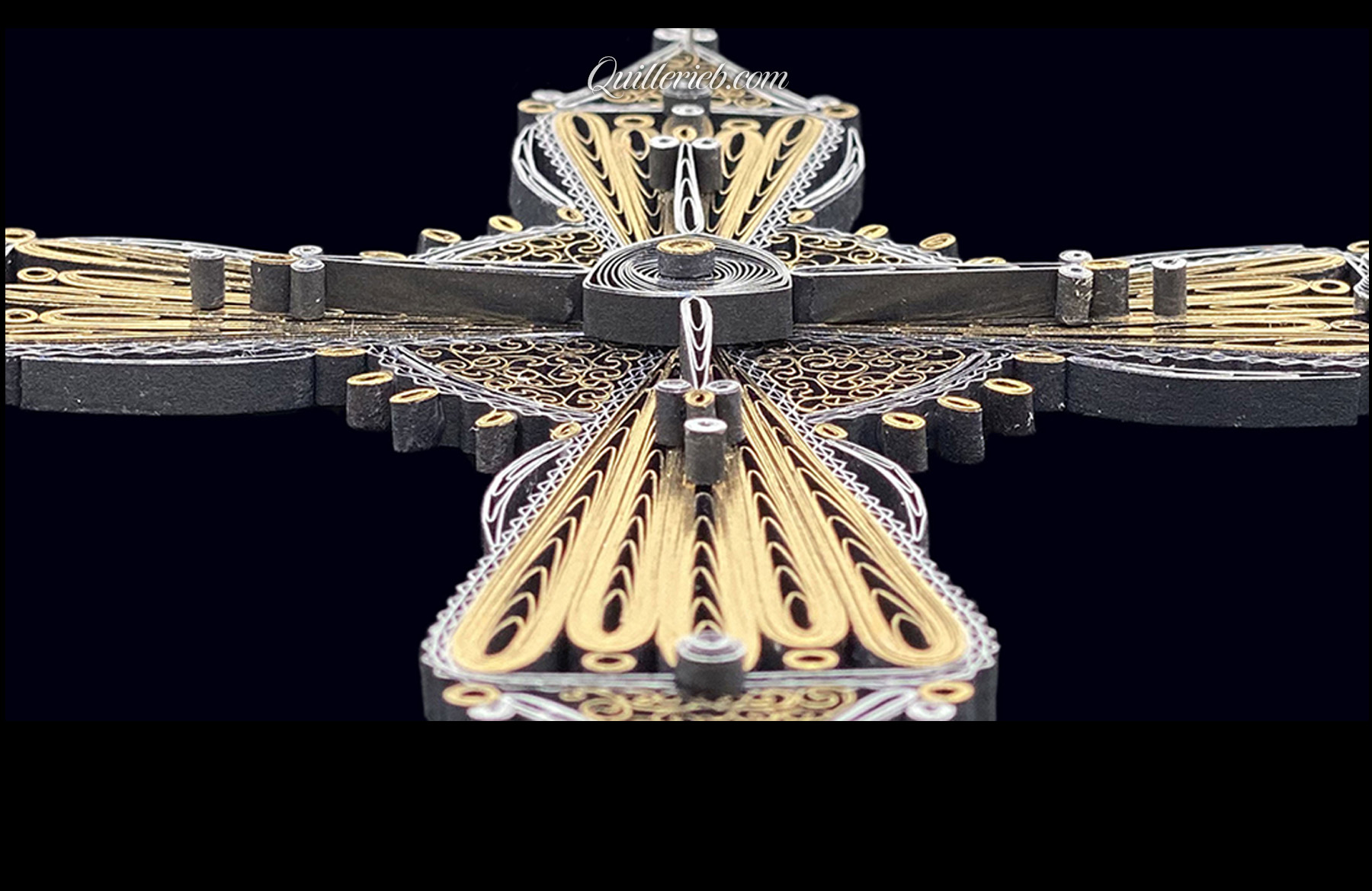 Image of 2nd quilled cross gold and silver in perspective slanting backwards.