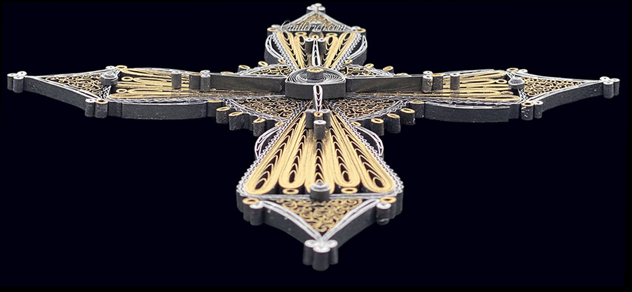 Image of 2nd quilled cross gold and silver in perspective slanting backwards showing full cross.