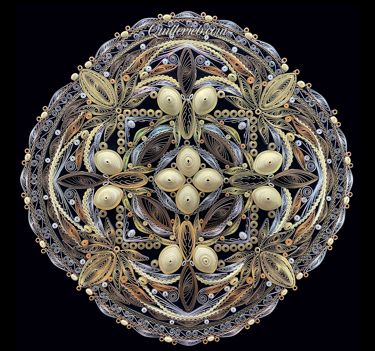 Circular quilled design in muted metallic color tones full view.