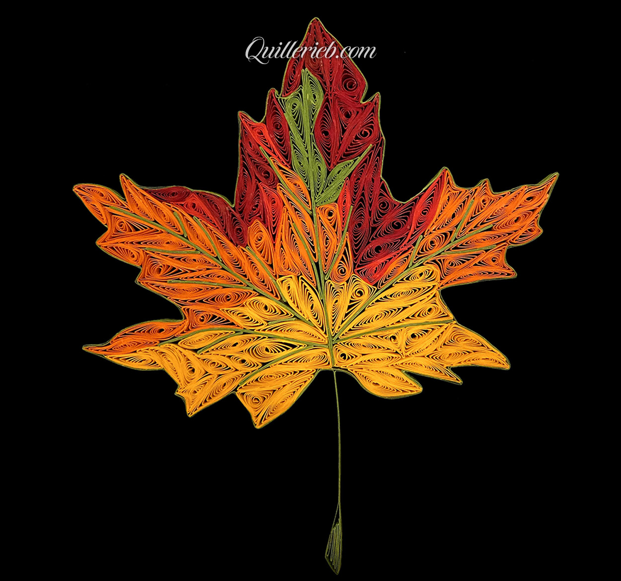 Fall leaf shape quilling in reds, yellows, oranges and greens full view.