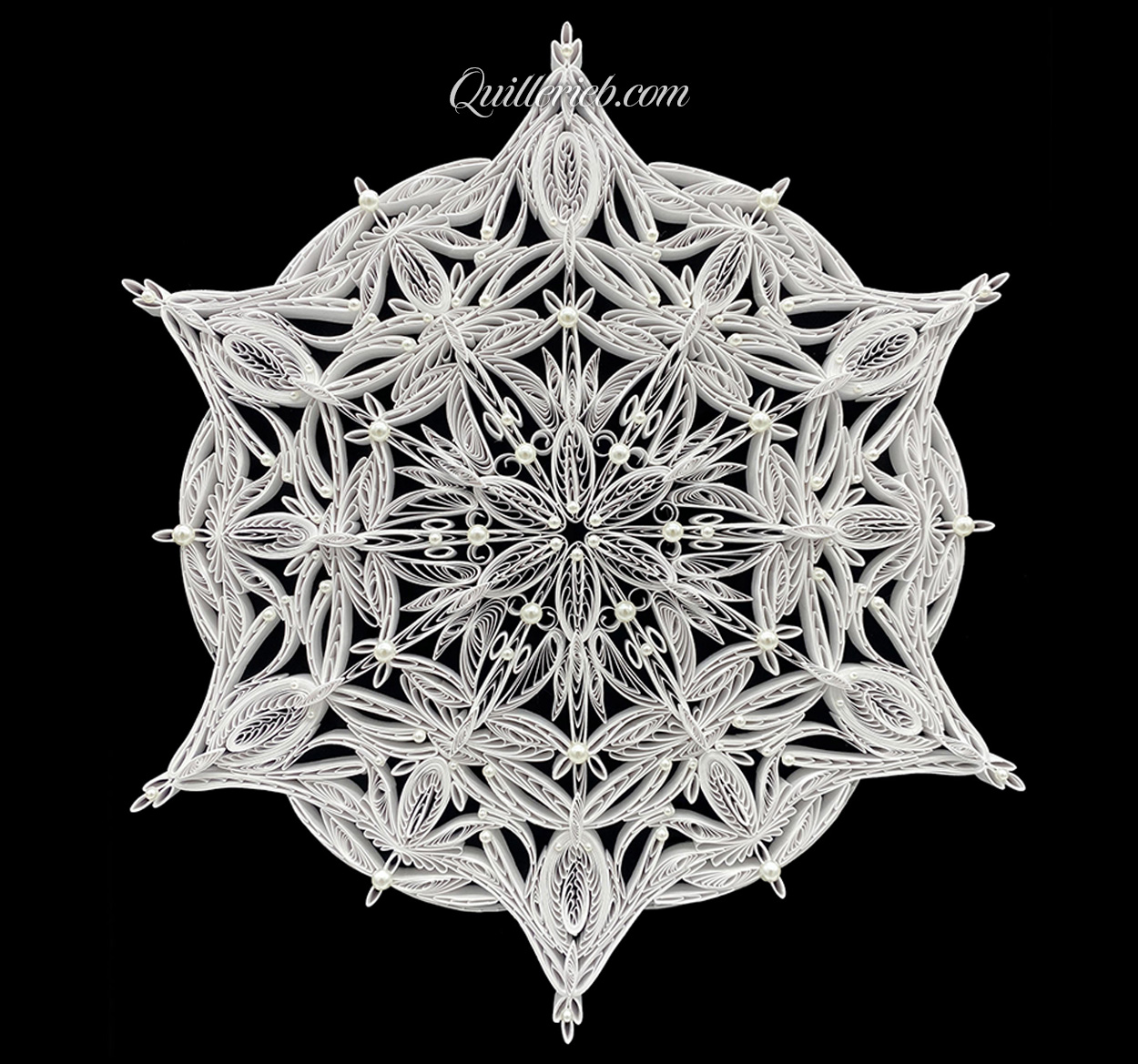 Circular 6-pointed quilling in white, snowflake design full view.
