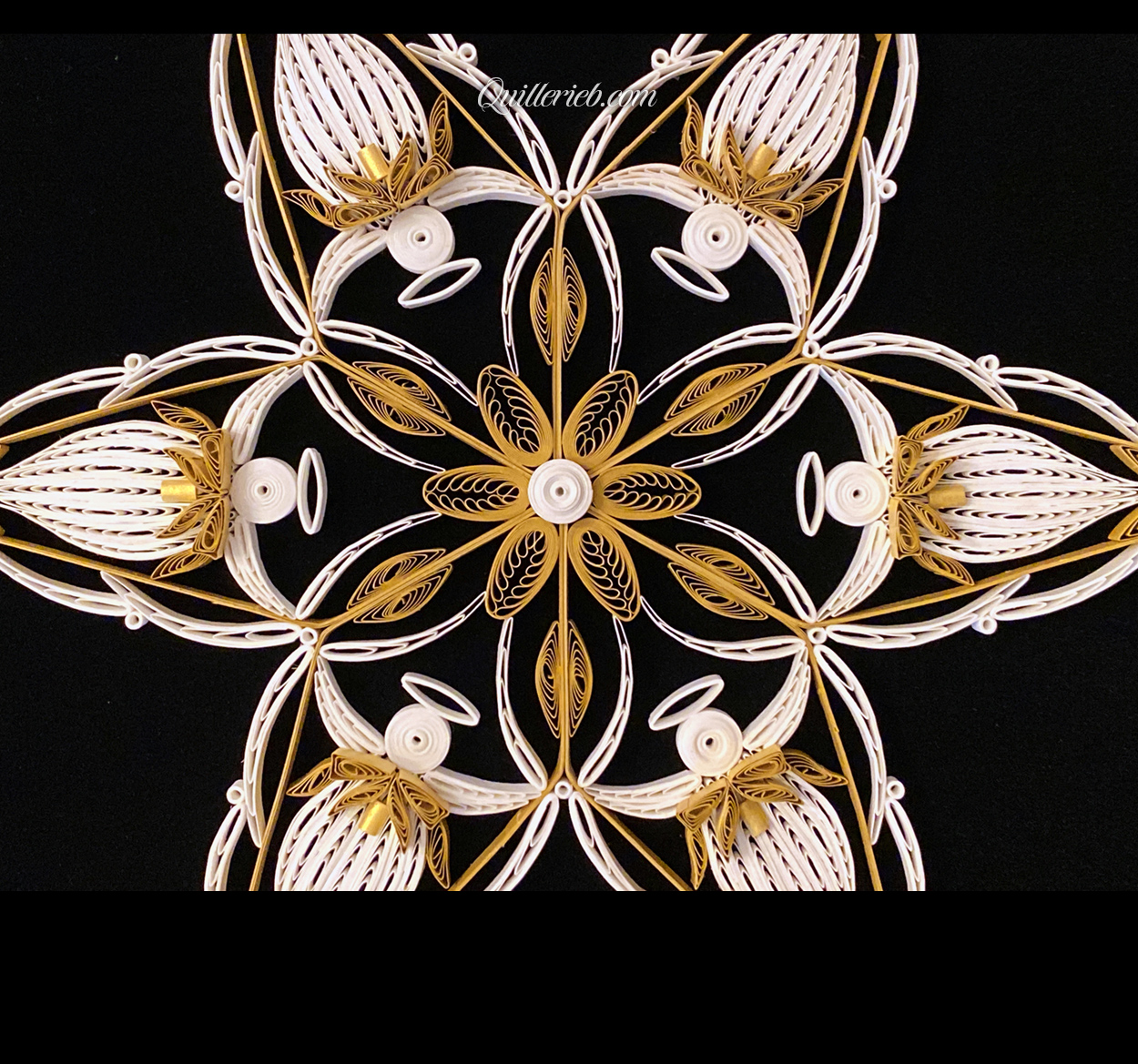 6-Point Star quilling design in white with elements of brown tones close-up centered view.