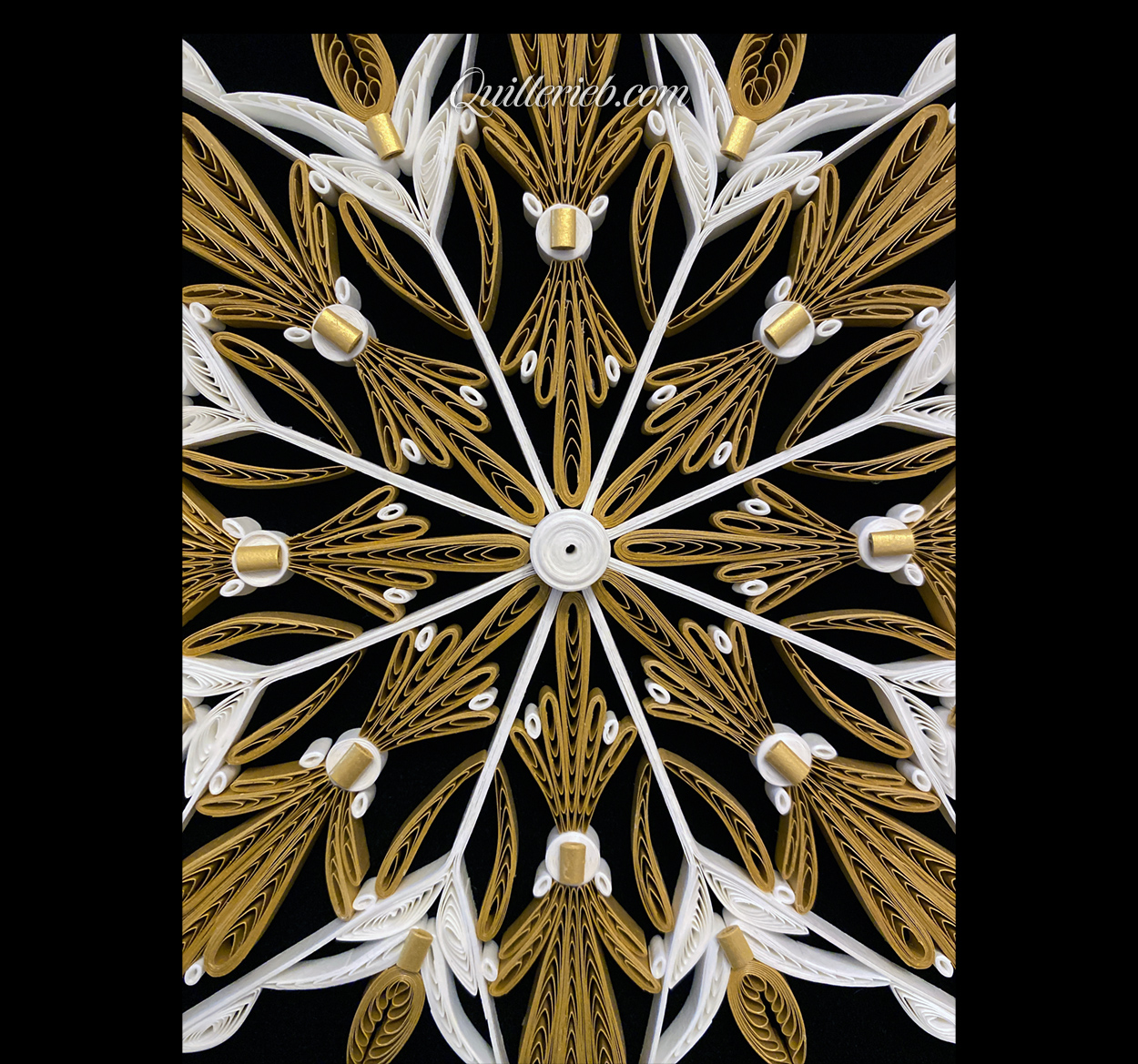 Eight-Point Star quilling design in brown tones and elements of white centered close-up view.