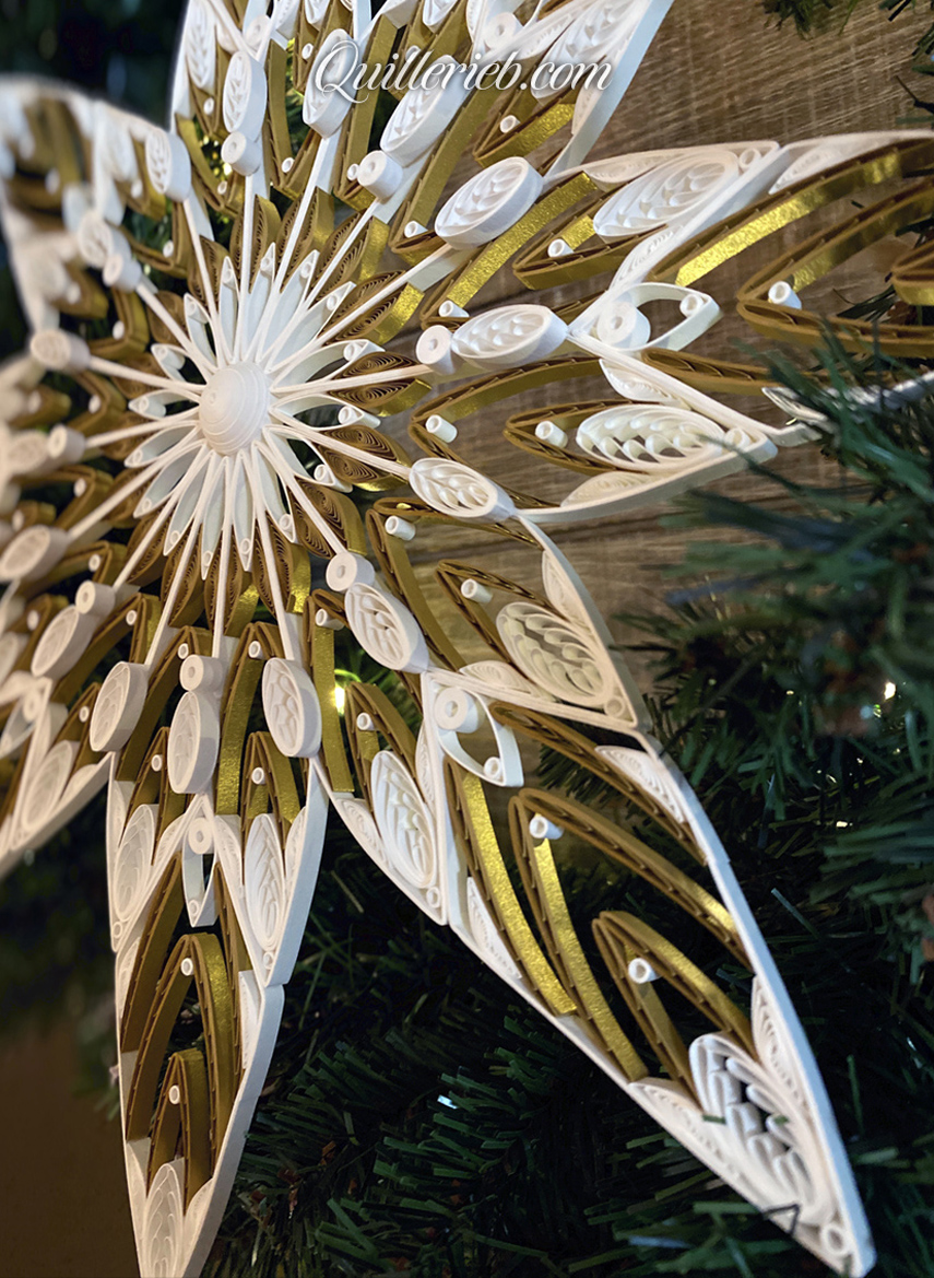 8-Point Star quilling design in brown and white tones perspective slanted left view.