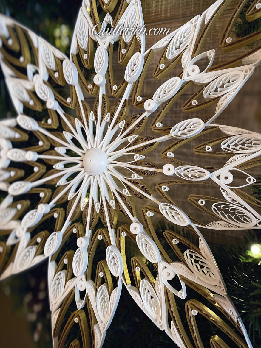 8-Point Star quilling design in brown and white tones perspective slightly slanted left view.